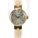 BUREN; a 1970s 9ct yellow gold lady's mechanical wristwatch, the silvered dial set with Arabic and