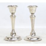 S BLANCKENSEE & SON LTD; a pair of Edward VII hallmarked silver candlestick with bell shaped