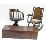 An early 20th century oak swivel desk chair, a rocking chair and a box (3).