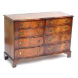 BEVAN FUNNELL; a reproduction mahogany double bowfronted chest of eight drawers raised on bracket