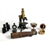 A small group of scientific instruments comprising Baker of London monocular microscope, military