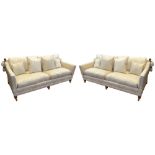 A pair of Knoll-style cream upholstered sofas, the upholstery with Chinese-style dragon detail,