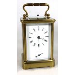 A brass cased carriage clock with Boseet pump alarm watch quarter repeating mechanism, the