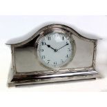 An Edwardian silver plated eight day domed mantel clock, the circular dial set with Arabic numerals,