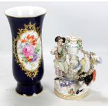 MEISSEN; a late 19th/early 20th century porcelain figure group of a couple flanking an urn and