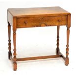 An oak single drawer side table with stretchered supports, width 65cm.
