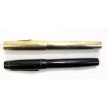 WATERMAN'S; a 14ct yellow gold fountain pen, the barrel engraved with the initials 'H.M.', and a