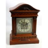 WINTERHALDER HOFMEIER; a circa 1900 walnut bracket clock with domed top above square brass dial with