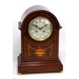 An Edwardian mahogany and inlaid mantel clock with domed top and circular dial set with Arabic