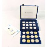 A Queen Elizabeth The Queen Mother commemorative coin set comprising nineteen sterling silver