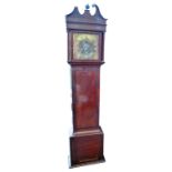 A George III mahogany longcase clock with broken swan neck pediment above 12" brass dial