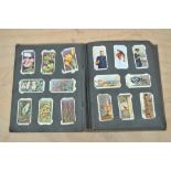 CIGARETTE CARDS; vintage slot-in album, mainly Players', Wills, Ogdens, etc.