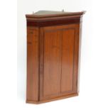 A George III oak and mahogany banded corner cupboard with dentil moulded cornice, width 80.5cm.