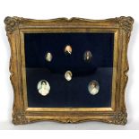 A group of six 19th century oval portrait miniatures, contained within a glazed frame, presumably on