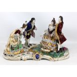 VOLKSTEDT; an early 20th century German porcelain figure group depicting a seated noblewoman with