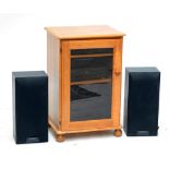 A 20th century pine stereo cabinet with glazed door, enclosing a stereo system, width 52cm.