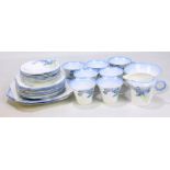 SHELLEY; a 'Blue Iris' pattern part tea set comprising seven teacups, seven saucers, eight side