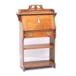 An early 20th century oak Arts and Crafts student's bureau, width 76cm.