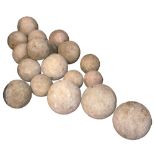 Eighteen carved English stone balls of varying sizes, diameter of largest approx 23cm. Provenance: