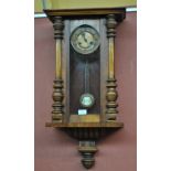 A walnut spring driven Vienna wall clock.