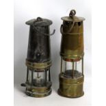 An unnamed all brass safety lamp, height 29.5cm, and a further unnamed safety lamp, height 27cm (