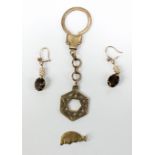 Three 9ct gold items comprising a Star of David fob on chain, length 9cm, a half moon unity charm