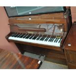 ZENDER; a mahogany framed upright piano, width 125.5cm.