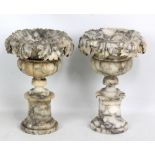 A pair of 19th century carved alabaster urns, height 27cm (af).