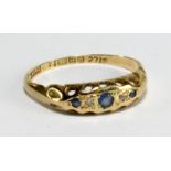 An 18ct yellow gold five stone dress ring set with blue and white coloured stones, size N, approx