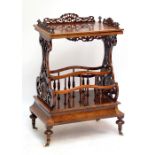 A Victorian burr walnut and walnut Canterbury whatnot with pierced end supports and single drawer to