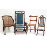 An American upholstered rocking chair, a similar smaller caned example, a bedroom chair and a tub