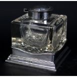 HENRY MATTHEWS; an Edward VII hallmarked silver topped cut glass inkwell of square form raised on