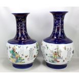 A pair of large modern Chinese decorative vases, the central white ground panels decorated with