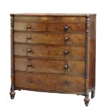 A William IV mahogany bowfronted chest of two short over four long drawers, flanked by twin