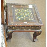A modern Indian teak square sectioned coffee table with glazed top, 47 x 47cm.