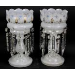 A pair of opaque glass lustres with gilt and enamelled detail, each suspending fourteen drops,