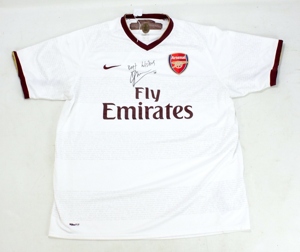 DENNIS BERGKAMP; a signed replica Arsenal football shirt.