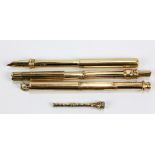 SAMPSON MORDAN & CO; two gold plated propelling pencil and ink nib holder combinations, the slightly