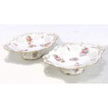 COALPORT; a pair of porcelain hand coloured floral transfer decorated oval comports with gilt