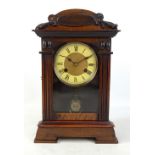 An early 20th century American mantel clock, the circular dial set with Roman numerals, height