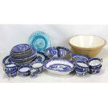 A quantity of transfer decorated 'Old Willow' and similar pattern ceramic tableware with