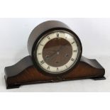 An Enfield Art Deco-style oak cased mantel clock, the silvered chapter ring set with Roman numerals,