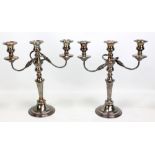 A pair of silver plated three light twin branch candelabra with detachable sconces convertible to