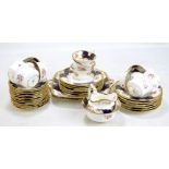 COALPORT; a floral and gilt decorated part tea set comprising tea cups and saucers, side plates,