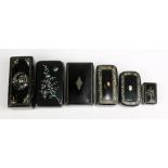 Six 19th century black lacquered papier-mâché snuff boxes of various sizes, five with mother of