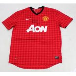 SIR ALEX FERGUSON; a signed replica Manchester United football shirt.