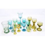 A group of glassware including Victorian green glass wine glasses, German engraved hock glasses, a