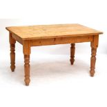 A 20th century rectangular pine kitchen table raised on ring turned legs.Additional InformationThe