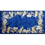 A blue ground Chinese superwash rug with cream floral decoration, 246 x 153cm. Additional