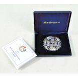 A 2006 Gibraltar Queen Elizabeth II 80th Birthday 5oz .925 silver proof £10 coin inset with a